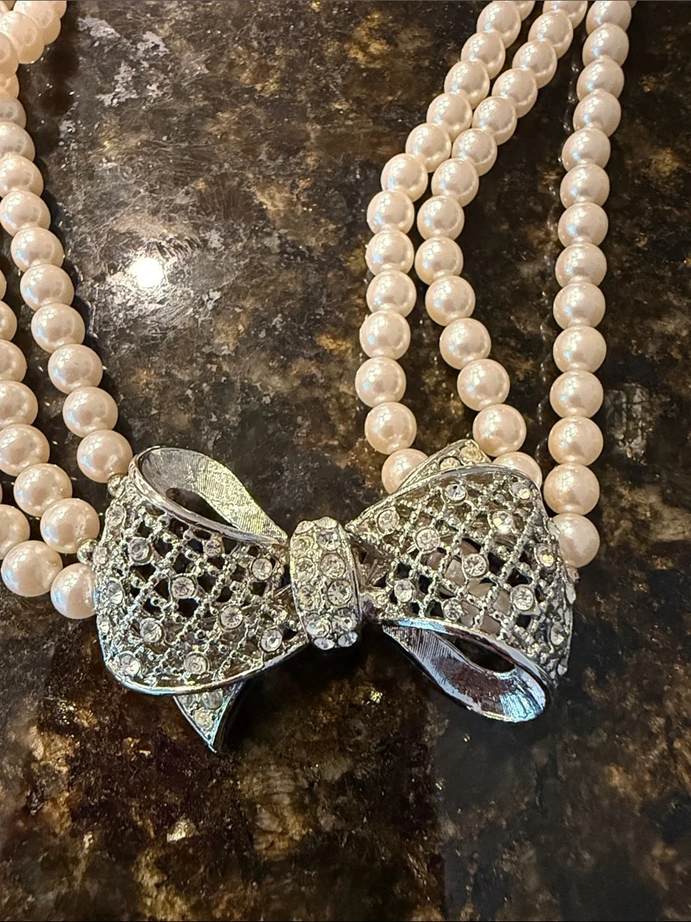 Elegant Pearl Multi-Strand Necklace with Bow Accent